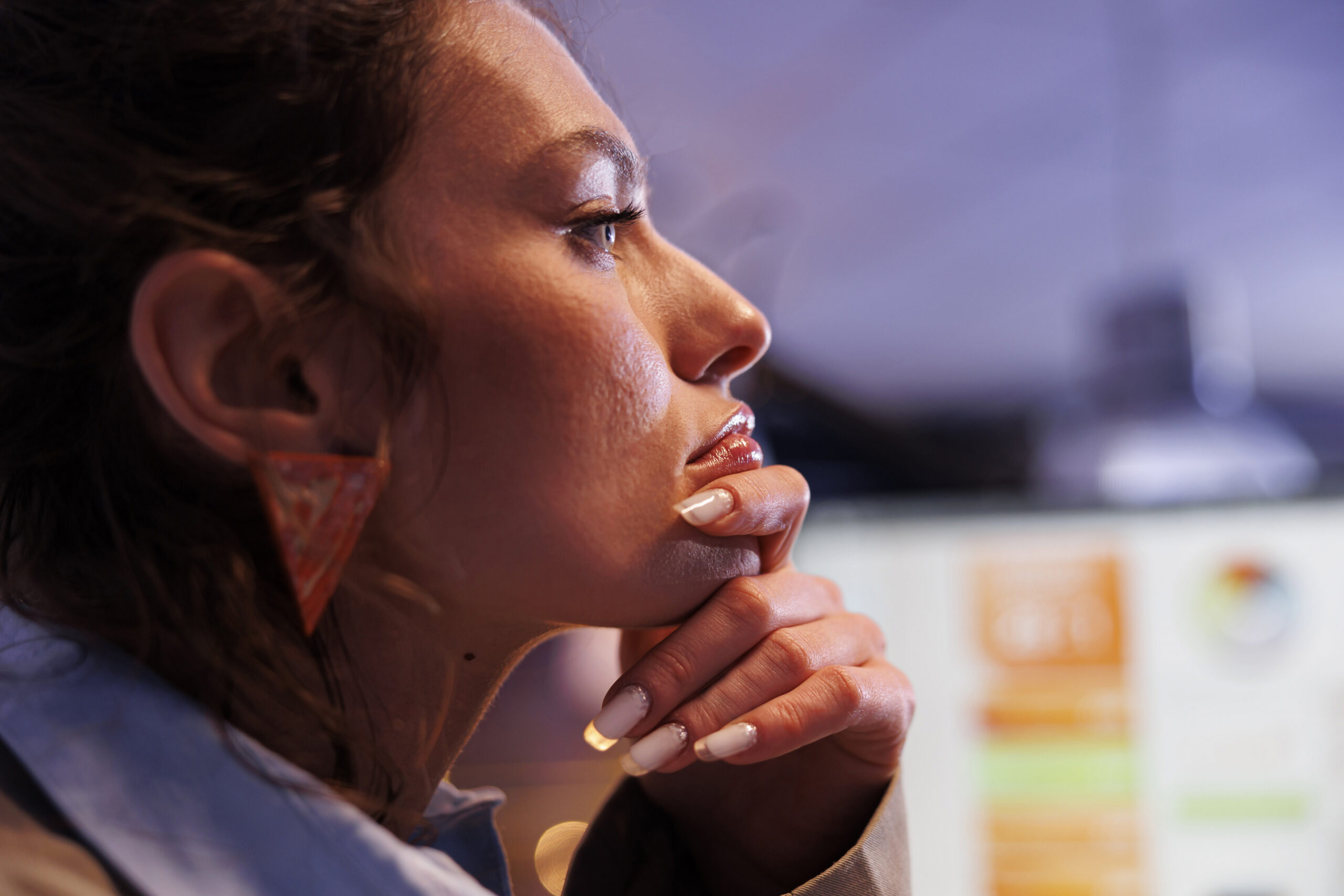 Female employee thinking about leadership skills training.